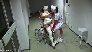 Patient in Wheelchair with Violated Gams and Straight-jacket - TheWhiteWard.com