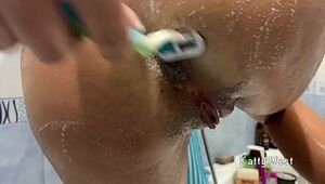Teenage Trims Unshaved Vagina in the Douche Close-up Katty West
